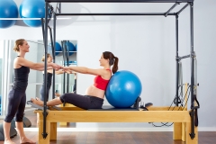 pregnant woman pilates reformer fitball exercise